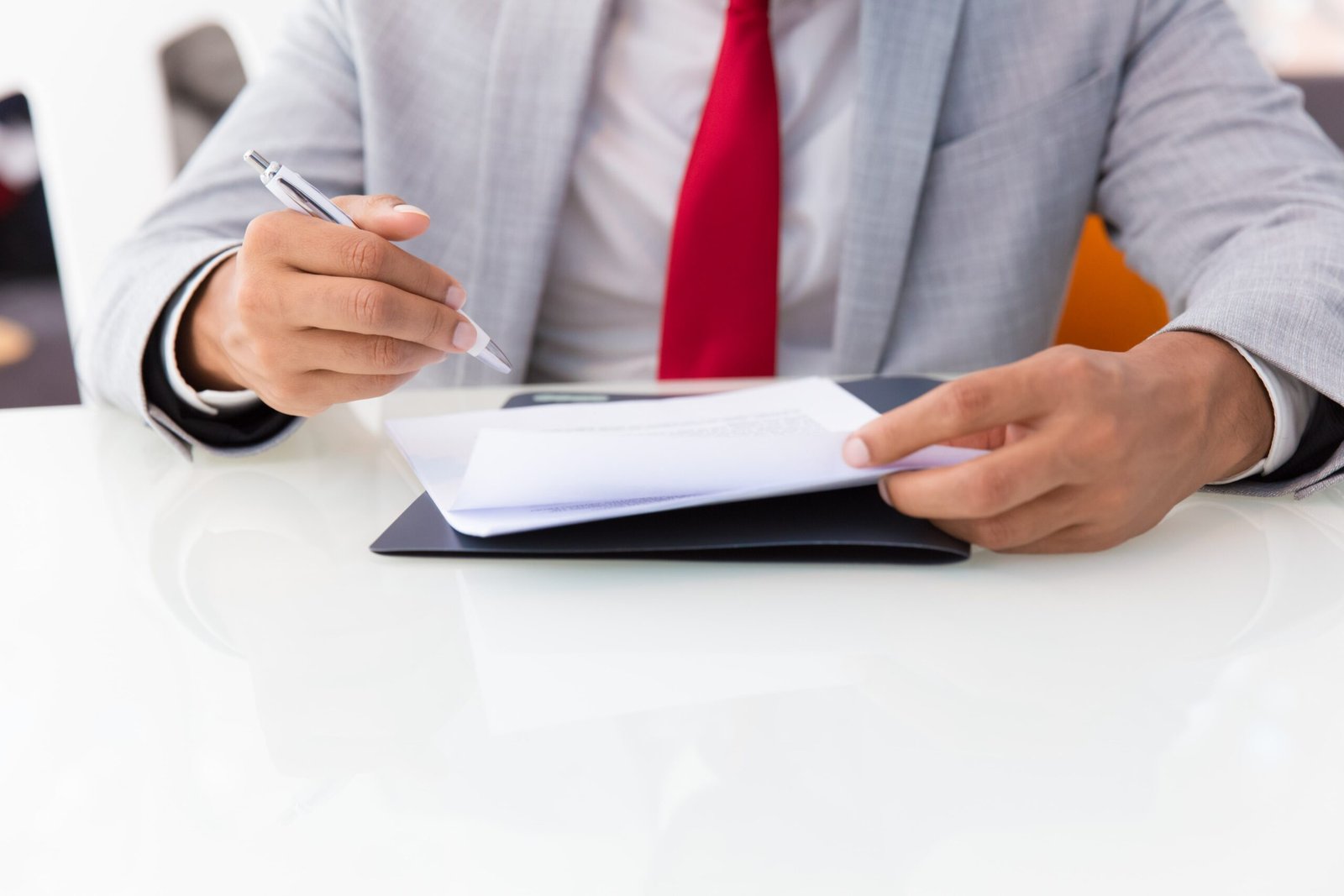 businessman-signing-contract-min
